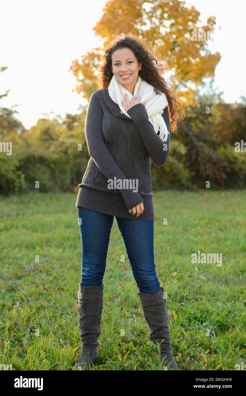 Smiling young woman in autumn Stock Photo