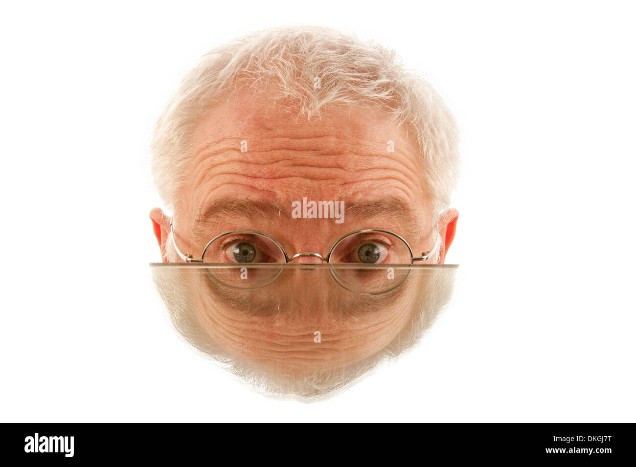 Top half of a mans face with mirror image combined Stock Photo