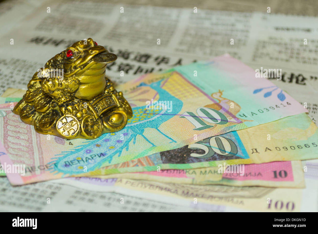 Money toad on Chinese newspaper and some Macedonian denar (MKD) banknotes  Stock Photo - Alamy