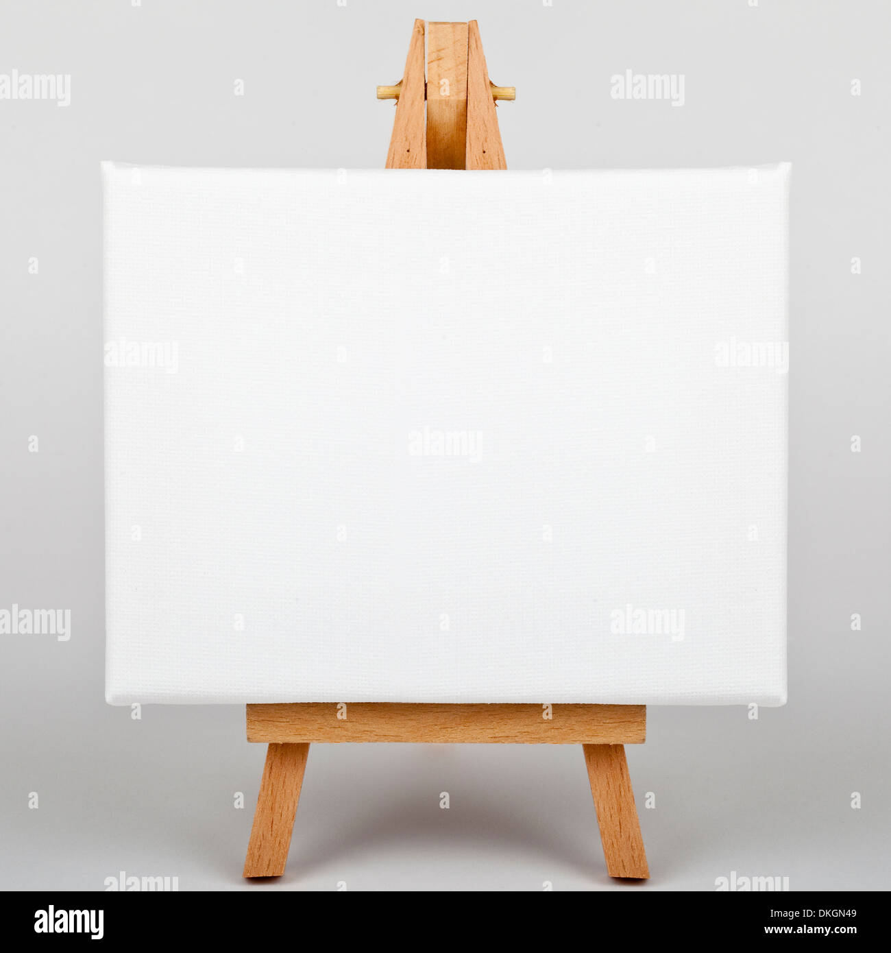 A white canvas on an easel. Stock Photo