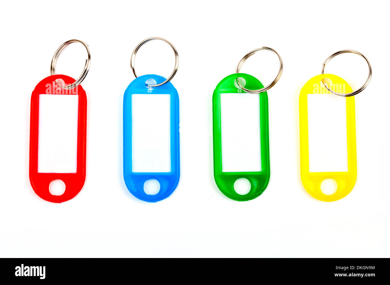 Coloured Key Tags over a white background Stock Photo - Alamy