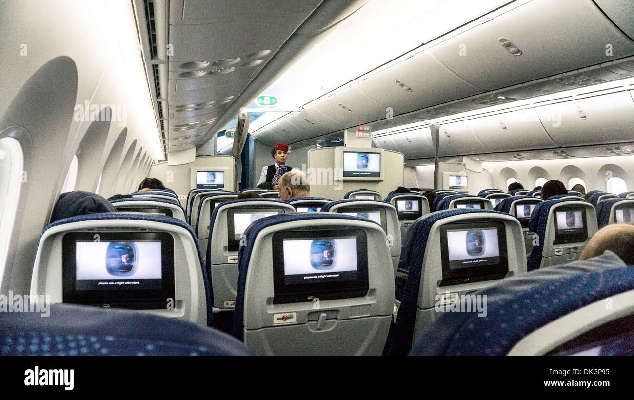 interior of Aeromexico Boeing 787 Dreamliner as Aeromexico flight attendant supervises showing of safety instructions video Stock Photo