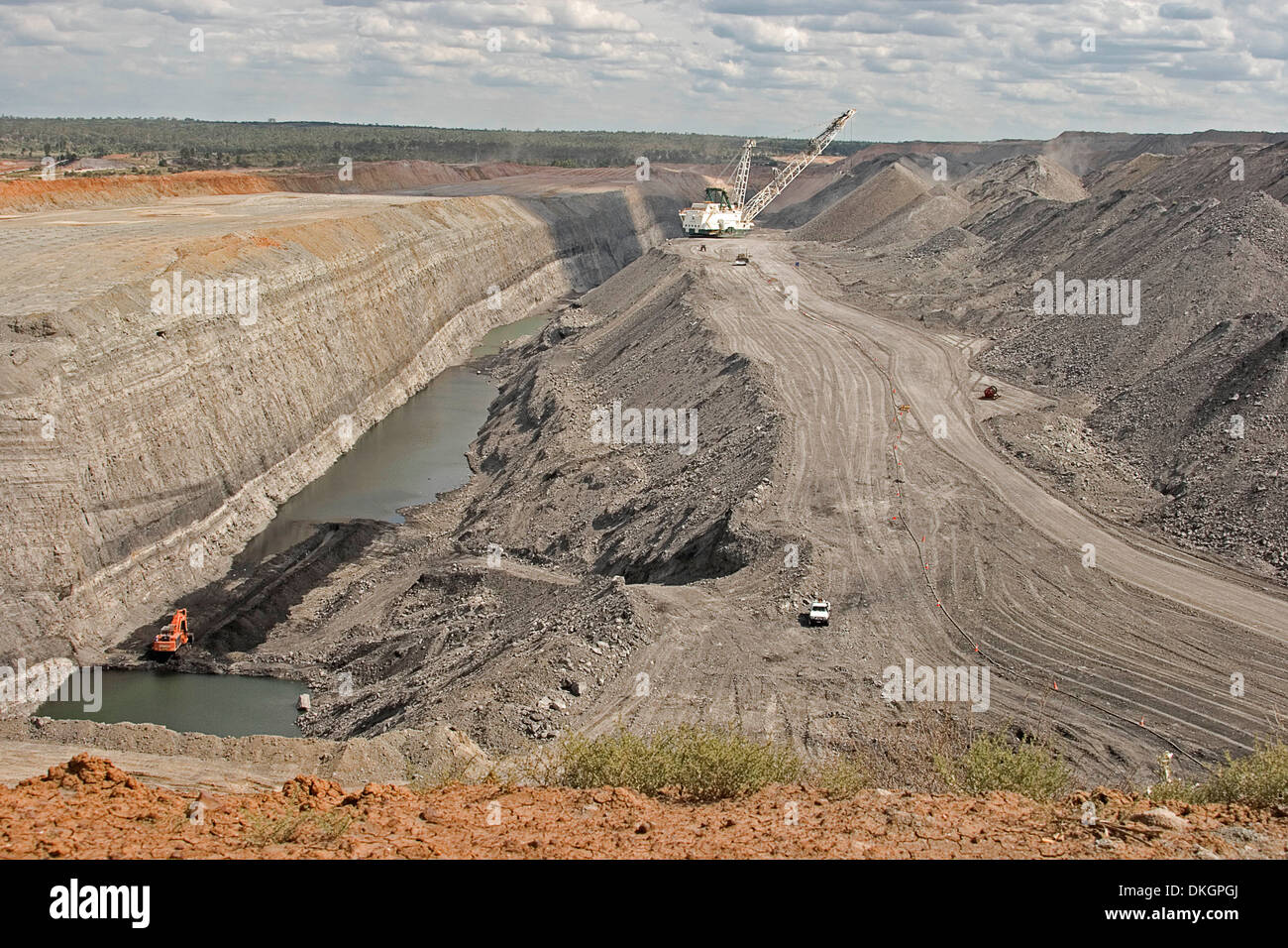 View of vast deep open cut coal mine, heaps of over burden and drag