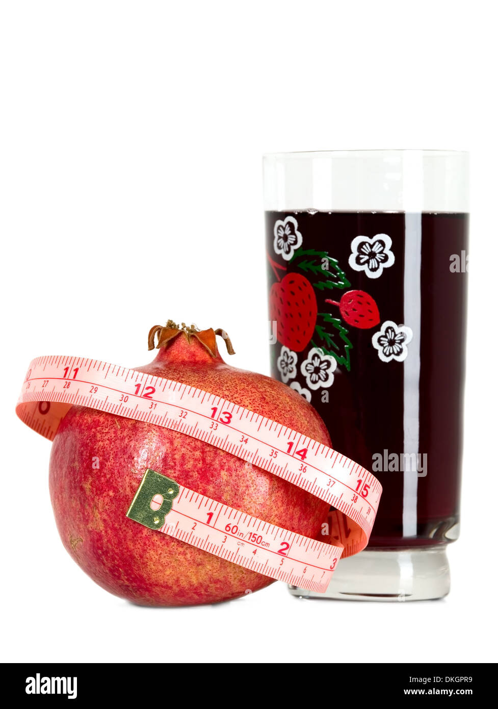 Red tasteful fruit garnet with measuring tape Stock Photo