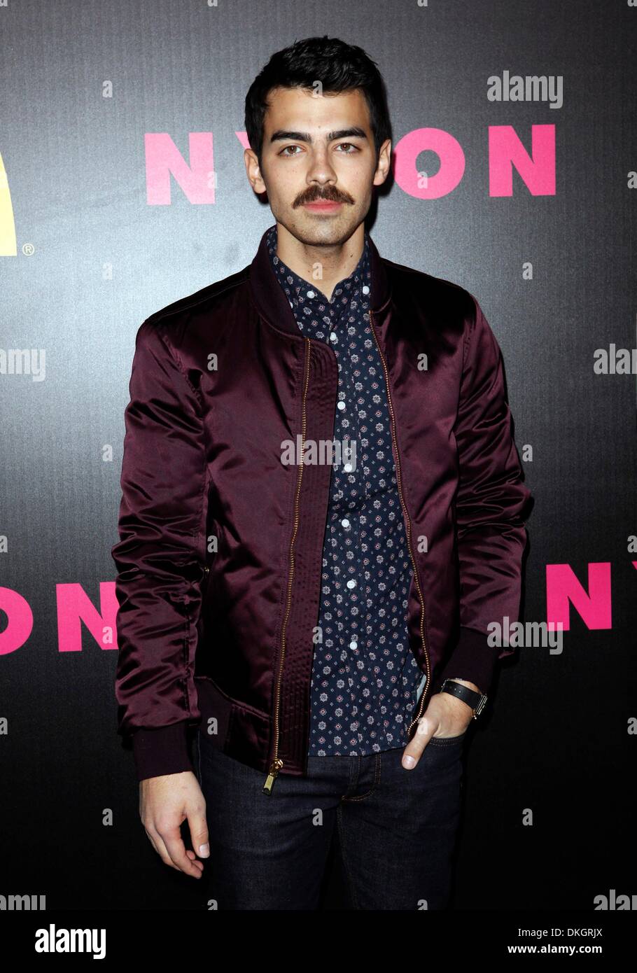 Los Angeles, CA, USA. 5th Dec, 2013. Joe Jonas at arrivals for NYLON Magazine December Issue Celebration, Smashbox Studios West Hollywood, Los Angeles, CA December 5, 2013. Credit:  Emiley Schweich/Everett Collection/Alamy Live News Stock Photo