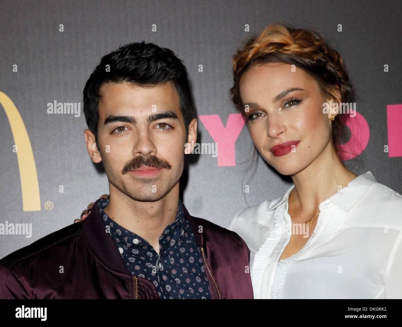 Los Angeles, CA, USA. 5th Dec, 2013. Joe Jonas, Blanda Eggenschwiler at arrivals for NYLON Magazine December Issue Celebration, Smashbox Studios West Hollywood, Los Angeles, CA December 5, 2013. Credit:  Emiley Schweich/Everett Collection/Alamy Live News Stock Photo