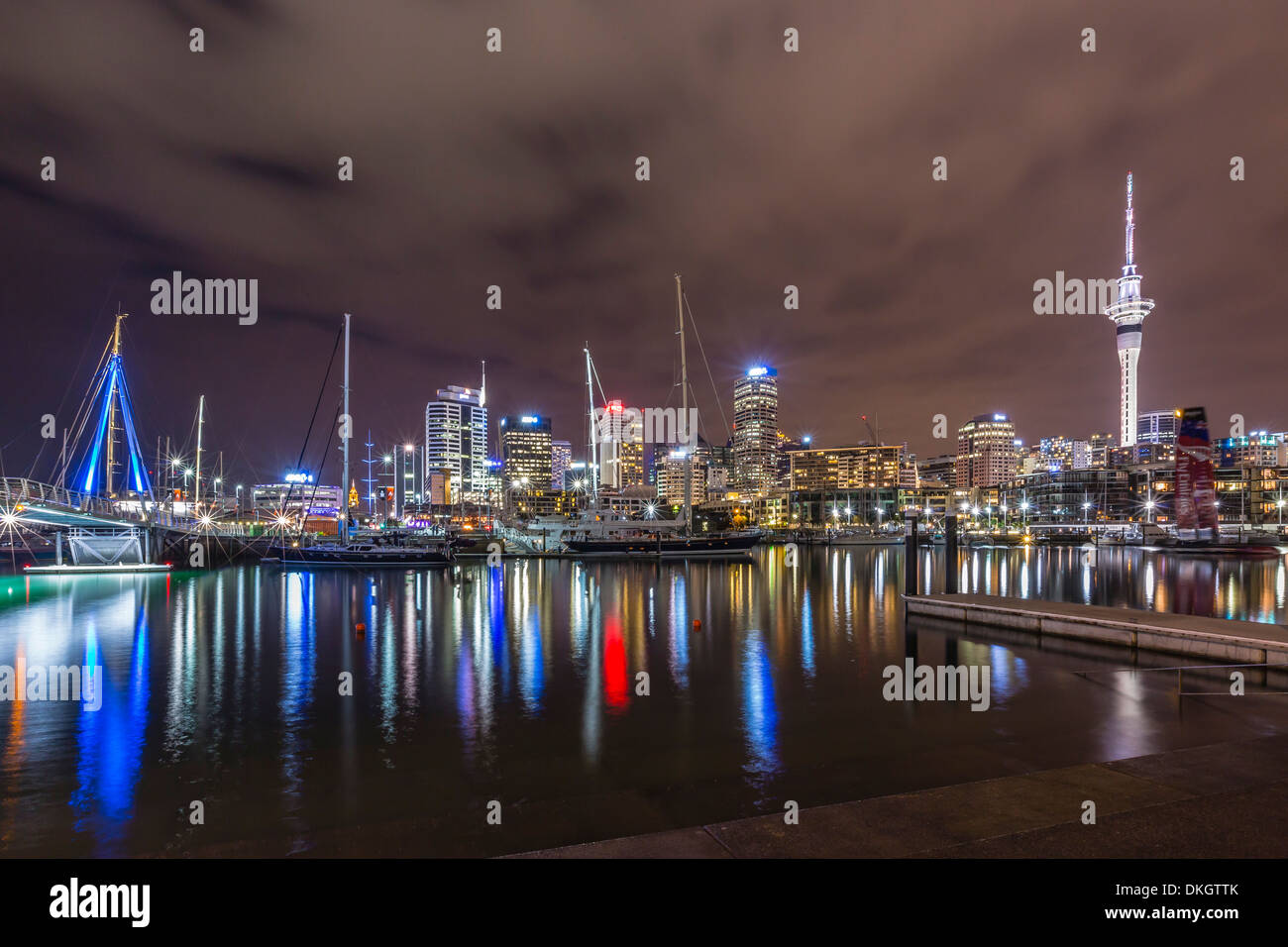 Night view of the city of Auckland from Auckland Harbour, North Island, New Zealand, Pacific Stock Photo