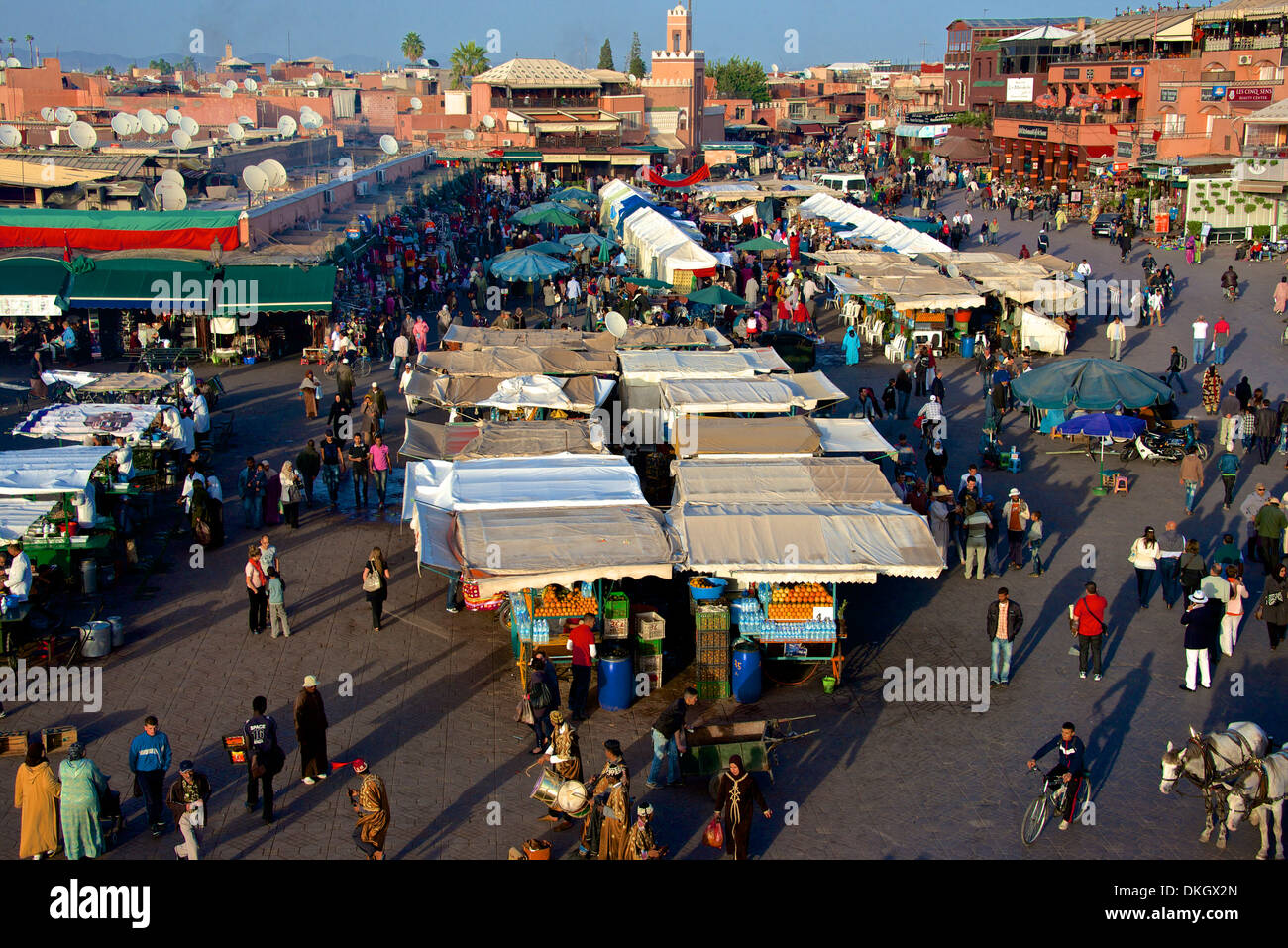 Restaurants, terraces, Kharbouch mosque and minaret, Jemaa-el-Fna Square, Marrakech, Morocco, North Africa, Africa Stock Photo