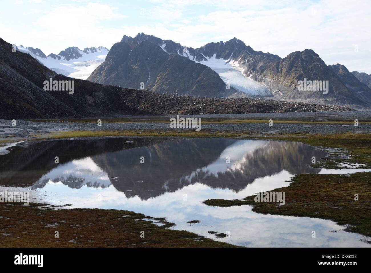 Mountains and reflections at Magdelenefjord, Svalbard Stock Photo