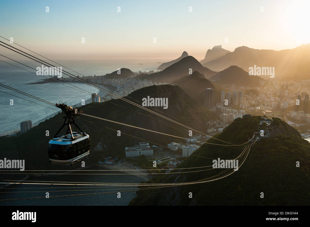 View from the Sugarloaf and the famous cable car at sunset, Rio de Janeiro, Brazil, South America Stock Photo