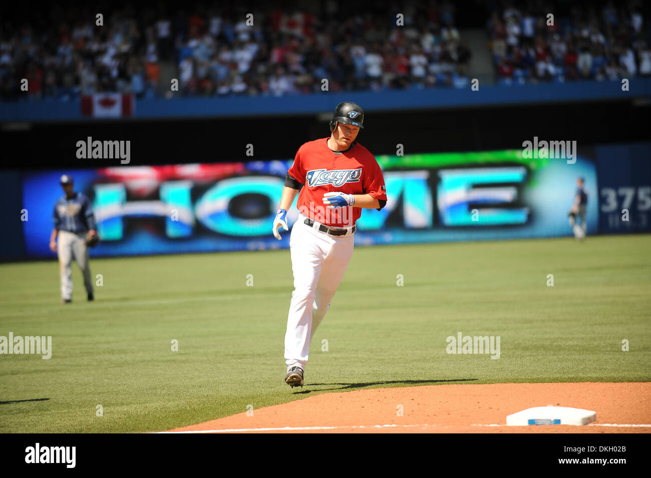July 01, 2009 - Toronto, Ontario, Canada - 01 July 2009: Toronto Blue Jays designated hitter Adam Lind (26) rounds the bases after hitting a home run off of Tampa Bay Rays starting pitcher James Shields (33) during the MLB game played between the Toronto Blue Jays and the Tampa Bay Rays  at the Rogers Centre in Toronto, ON.  The Blue Jays would go on to defeat the Rays 5-0. *****Ed Stock Photo