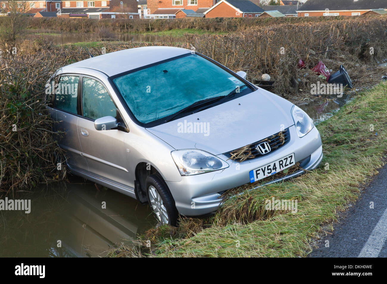 South Ferriby, North Lincolnshire, England, UK. 6th December 2013. An abandoned vehicle in the North Lincolnshire village of South Ferriby near the River Humber, which has been damaged by the tidal surge. South Ferriby, North Lincolnshire, England, UK. 6th December 2013. Credit:  LEE BEEL/Alamy Live News Stock Photo