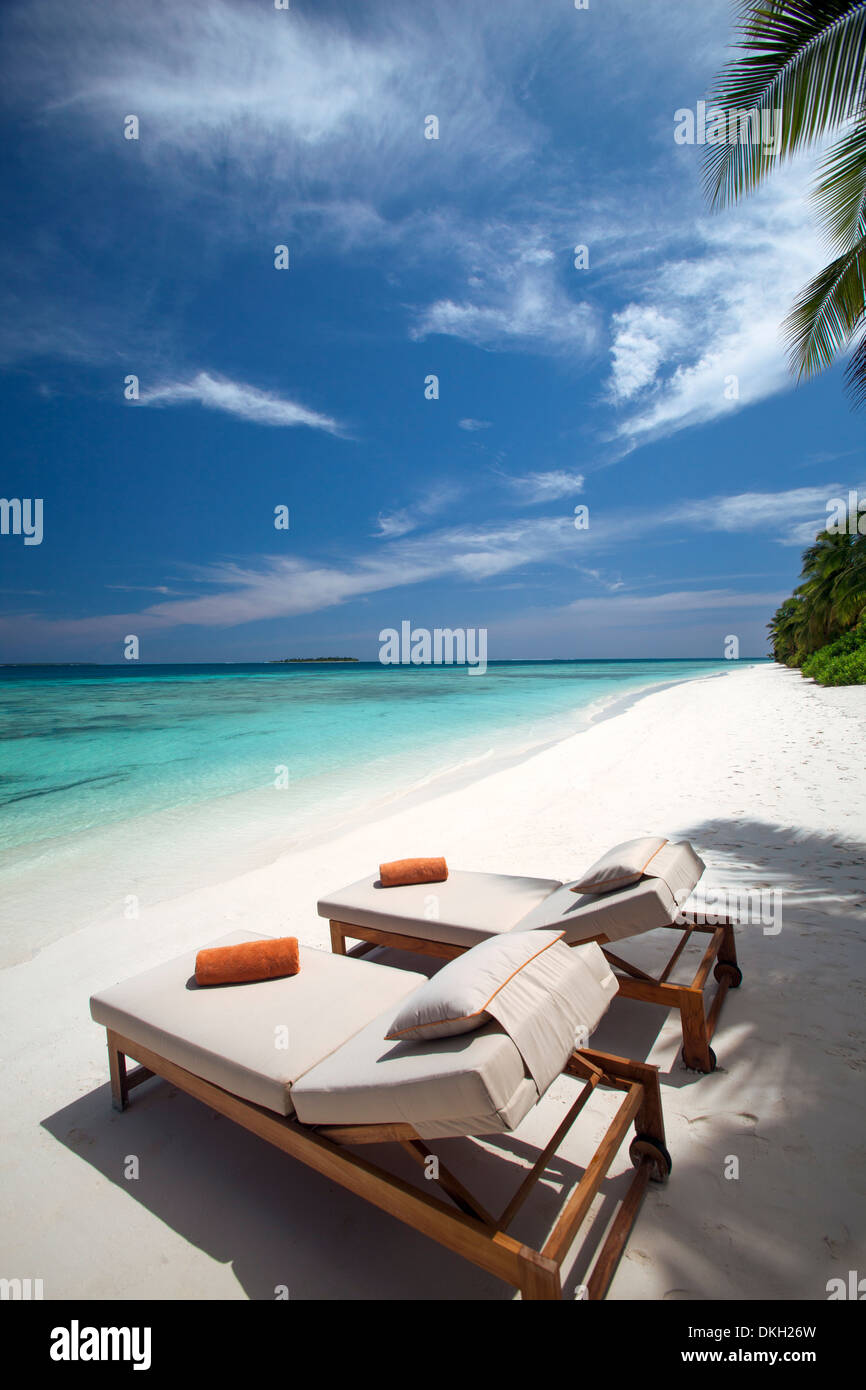Lounge chairs on tropical beach, Maldives, Indian Ocean, Asia Stock Photo