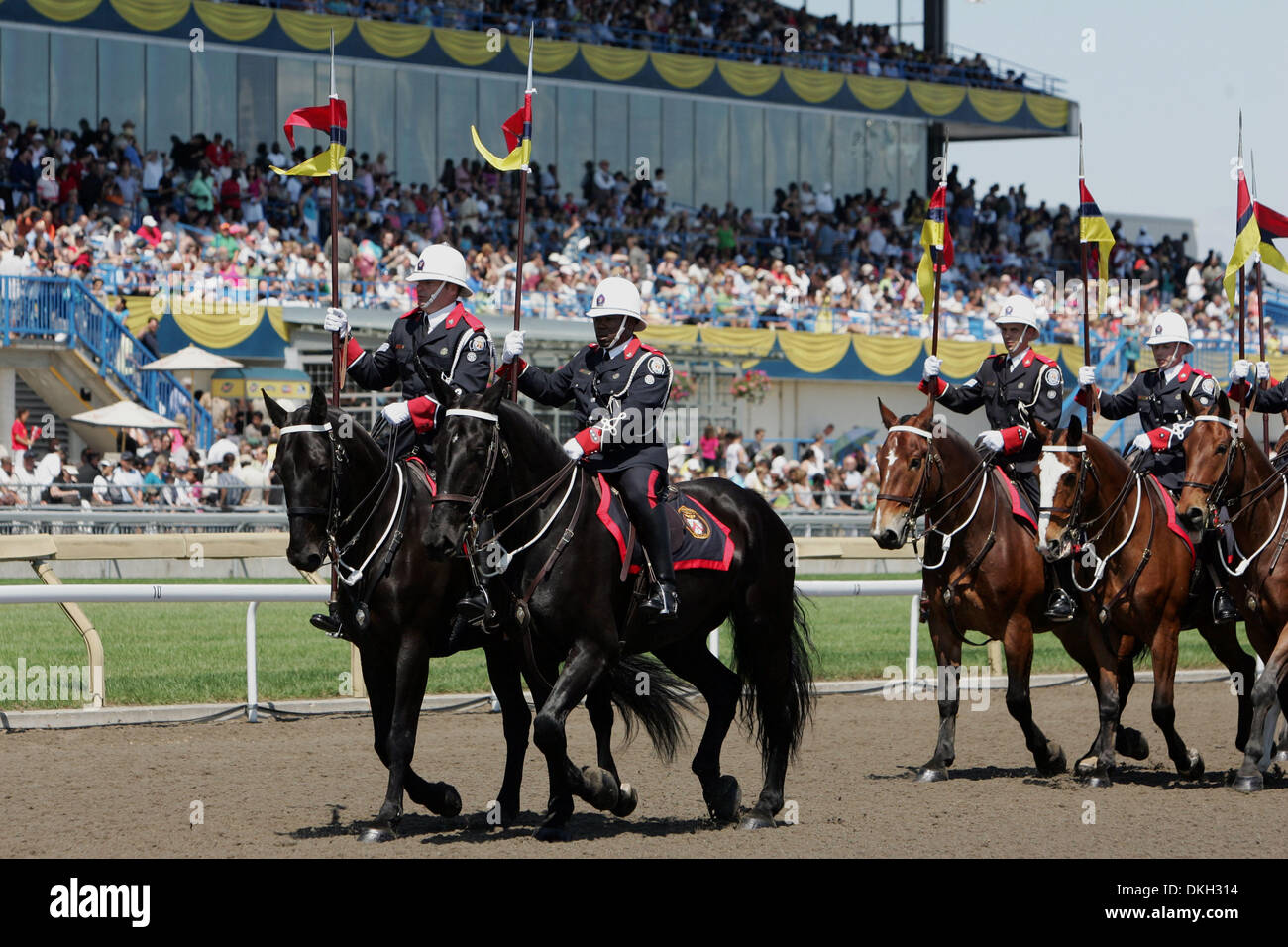 The Toronto Police Service Mounted Unit march at the 150th Queens Plate