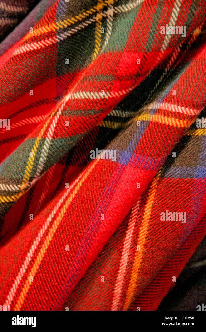 Close up of tartan fabric. Combination of reds, greens, blues & cream. Traditionally Scotish representing clans, Scotland. Stock Photo