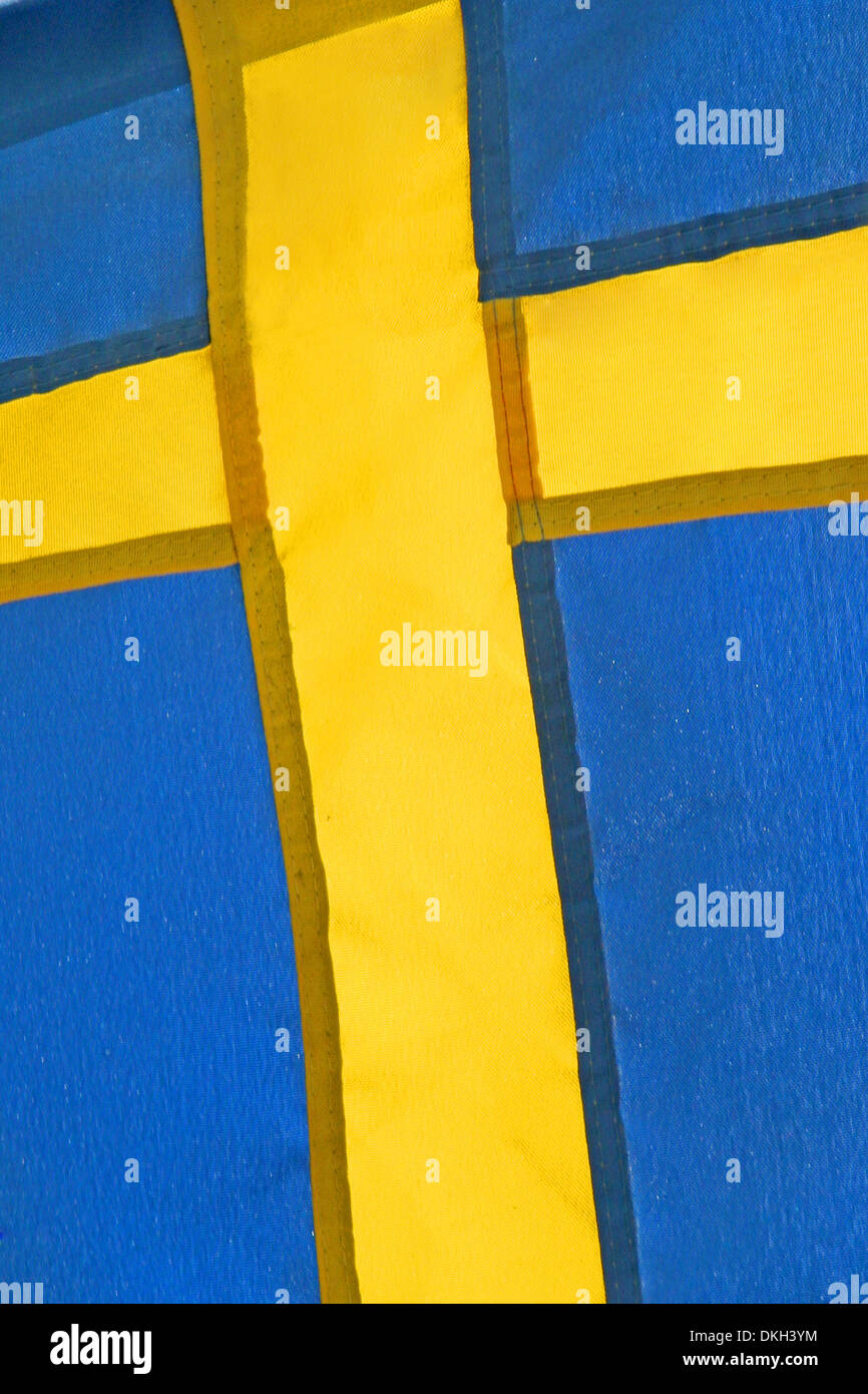 Close up of the National flag of Sweden in Scandinavia, Europe. With a yellow cross over a blue background. Stock Photo