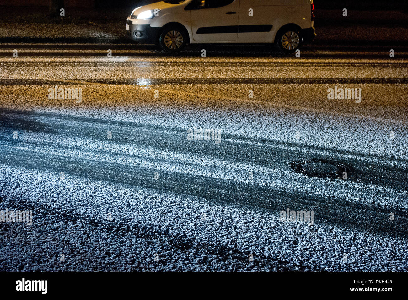 Stralsund, Germany. 5th Dec, 2013. Hail stones cover a street in Stralsund, Germany, 5 December 2013. Storm front Xaver hits northern Germany. Photo: Stefan Sauer/dpa/Alamy Live News Stock Photo