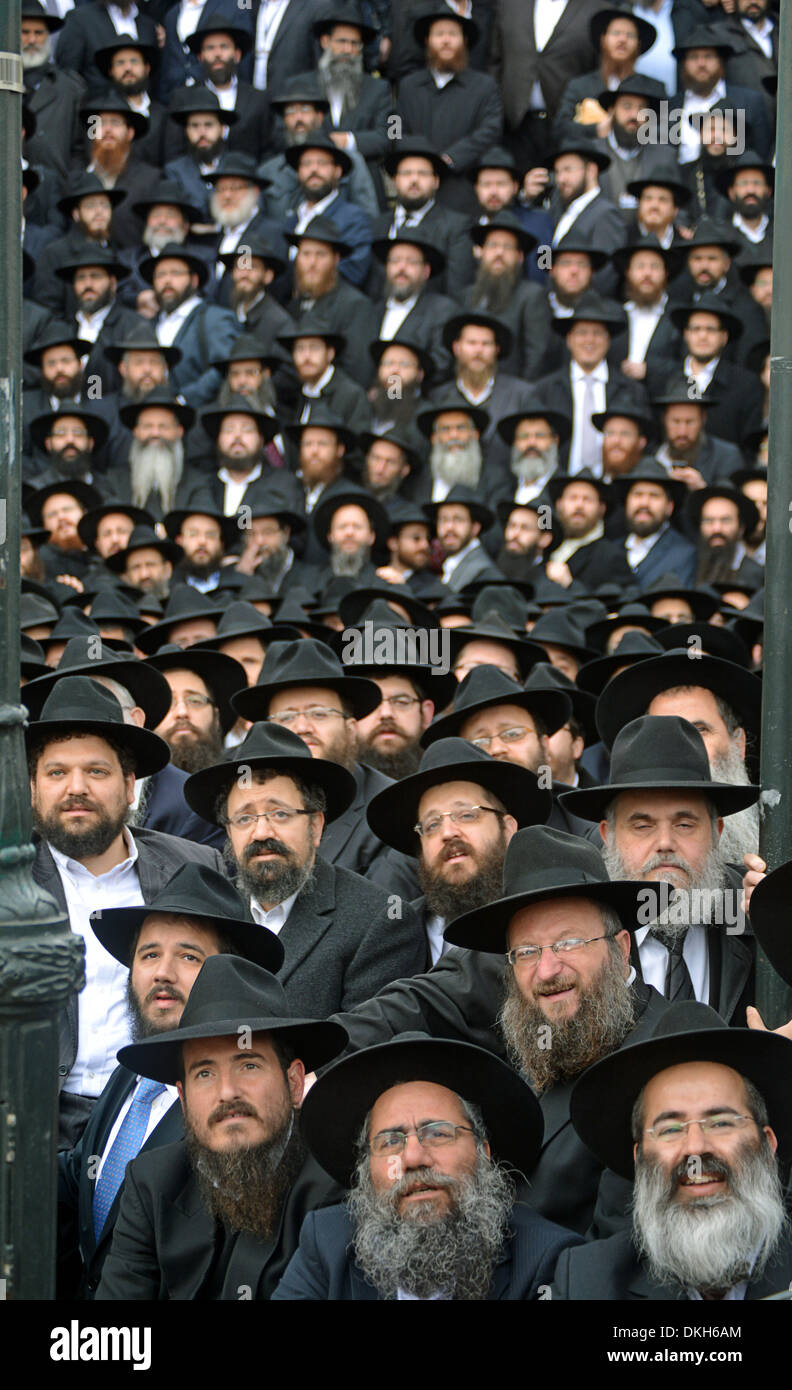 Several rabbis seated preparing for a group photo at the convention of ...