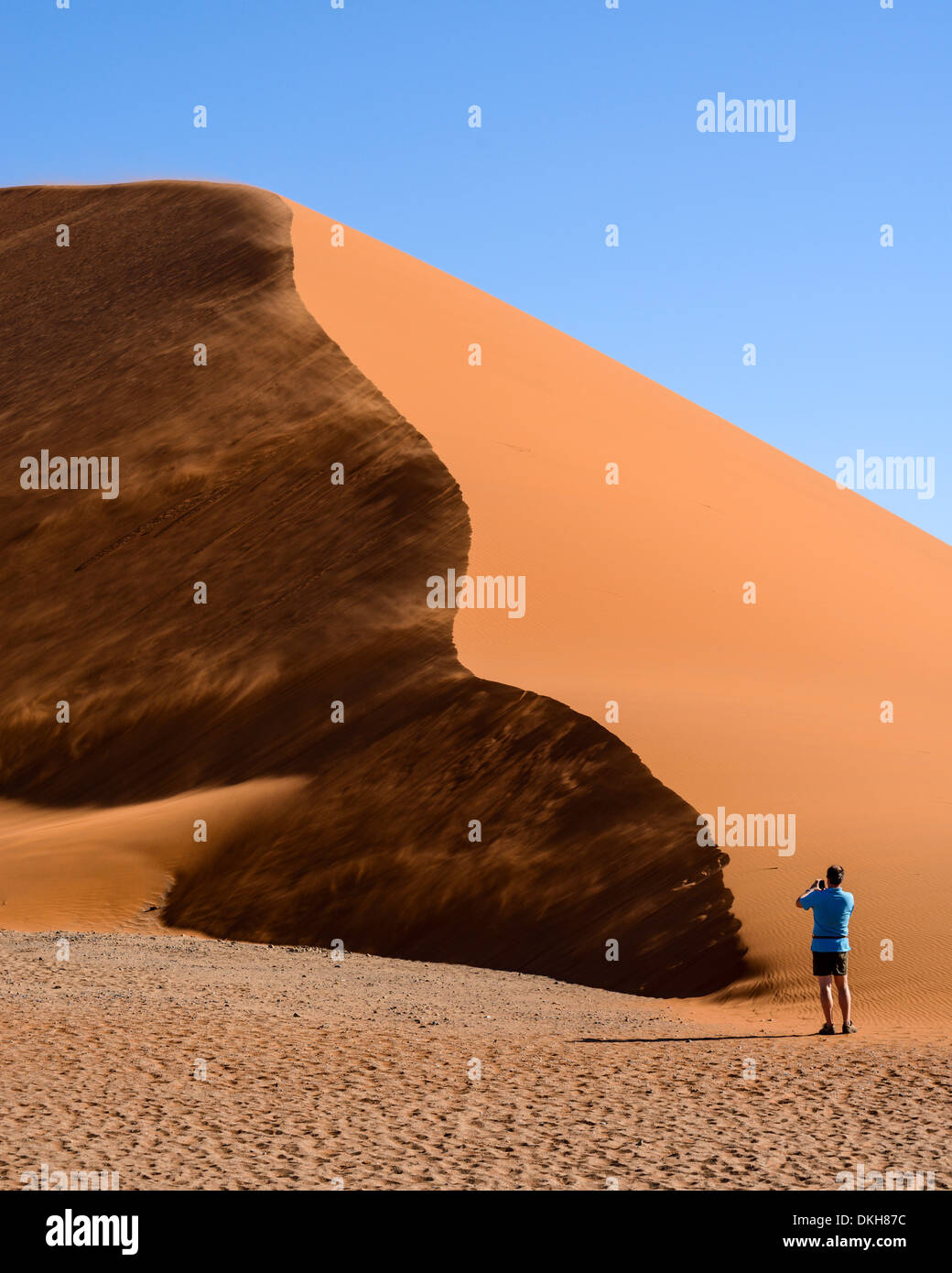 Photographing a wind-swept Dune 45, Sessriem, Namib Naukluft, Namibia, Africa Stock Photo