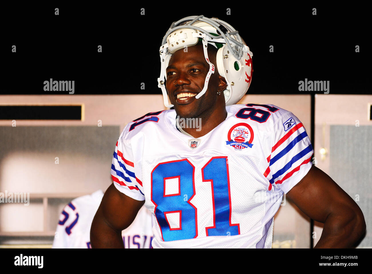 Buffalo Bills widereciever Terrell Owens is all smiles as he models the  throwback jersey for the 50th season celebration durring Thursday nights  practice at St. John Fisher College in Rochester, NY (Credit
