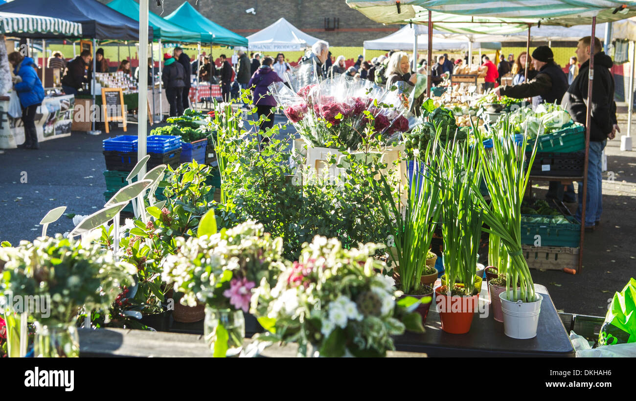 Farmers market, Parliament Hill, London UK. Market traders sell seasonal produce - fruit, vegetables, flowers. Stock Photo