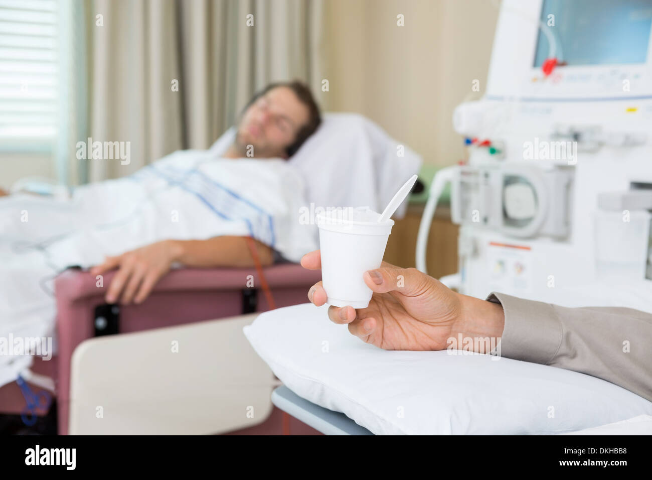 Cancer Patient Holding Glass Of Crushed Ice Stock Photo Alamy