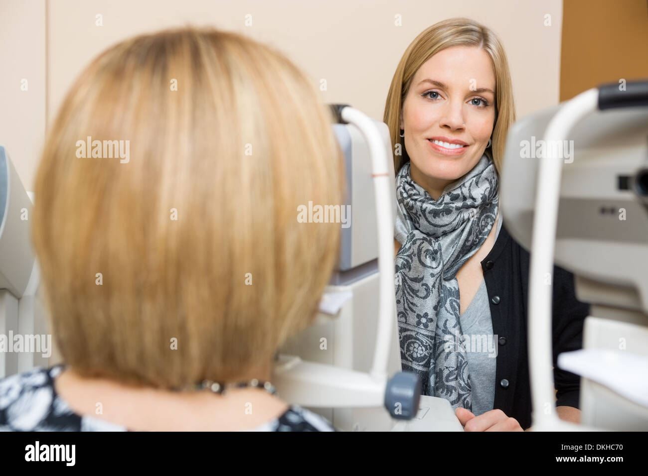 Optometrist Using Tonometer to Measure Patients Eye Pressure Stock