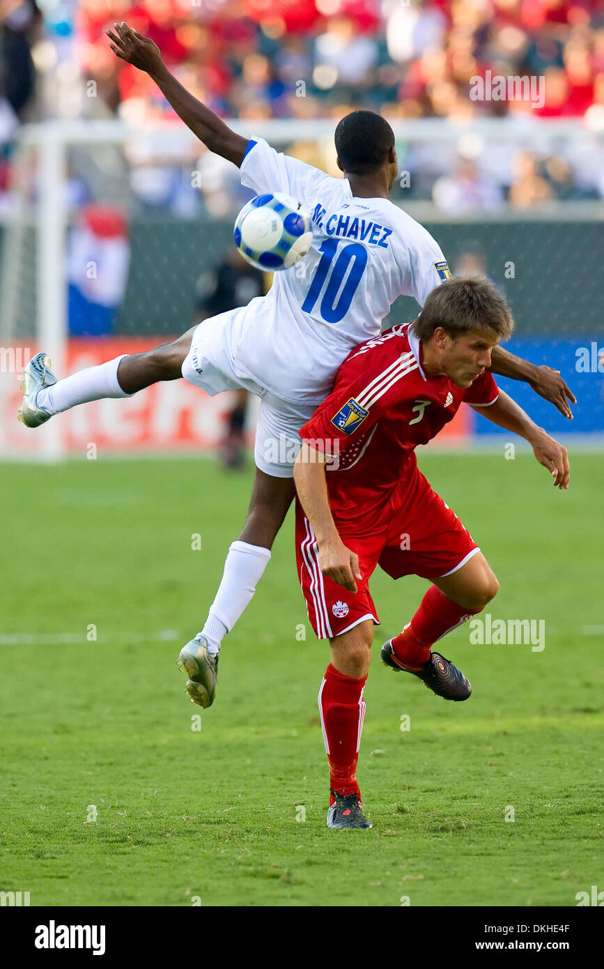 Honduras' attacker Marvin Chavez (10) misses the ball while falling on Canada's midfielder Mike Klukowski (3) during the CONCACAF Gold Cup quarter finals match between Canada and Honduras at Lincoln Financial Field in Philadelphia, Pennsylvania.  Honduras beat Canada, 1-0. (Credit Image: © Chris Szagola/Southcreek Global/ZUMApress.com) Stock Photo