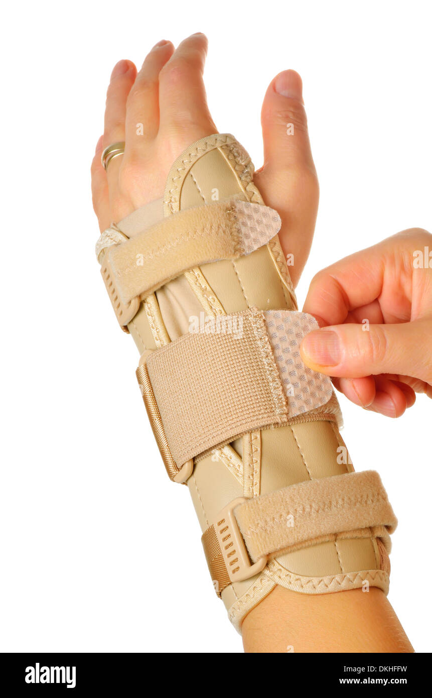 hand with a orthopedic wrist stabilizer over white background Stock Photo