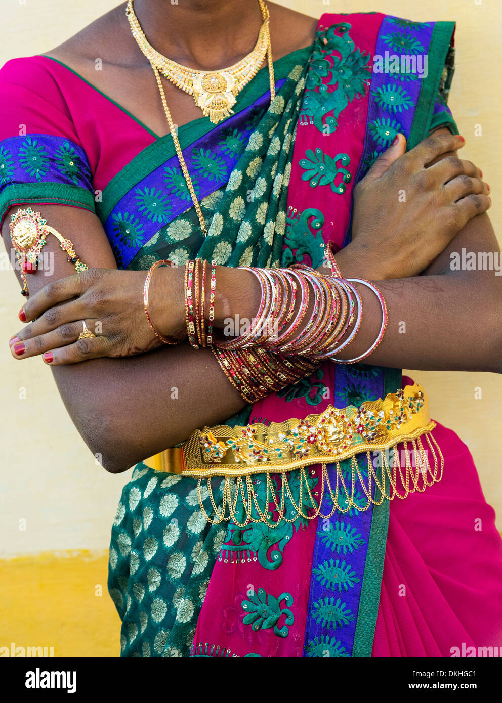 Rural Indian village bride dressed in colourful sari and gold jewelry. Andhra Pradesh, India Stock Photo
