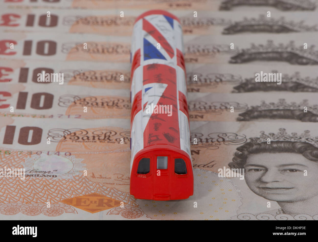 A Model London Underground Train On A Pile Of Ten Pound Notes Stock Photo