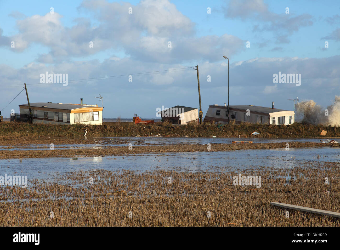 Walcott, Norfolk,UK. 6th December 2013.  The largest tidal surge since 1953 hits Walcott overnight & caused vast damage. Residents had been evacuated yesterday for their own safety. Credit:  Paul Lilley/Alamy Live News Stock Photo