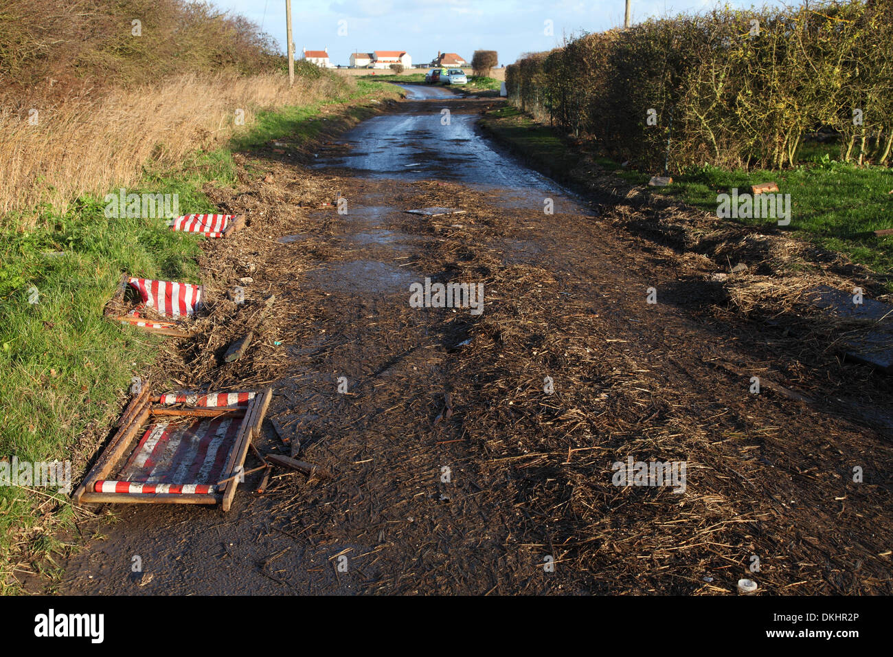 Walcott, Norfolk,UK. 6th December 2013.  The largest tidal surge since 1953 hits Walcott overnight & caused vast damage. Residents had been evacuated yesterday for their own safety. The deck chairs seen here are about half a mile from the seafront. Credit:  Paul Lilley/Alamy Live News Stock Photo