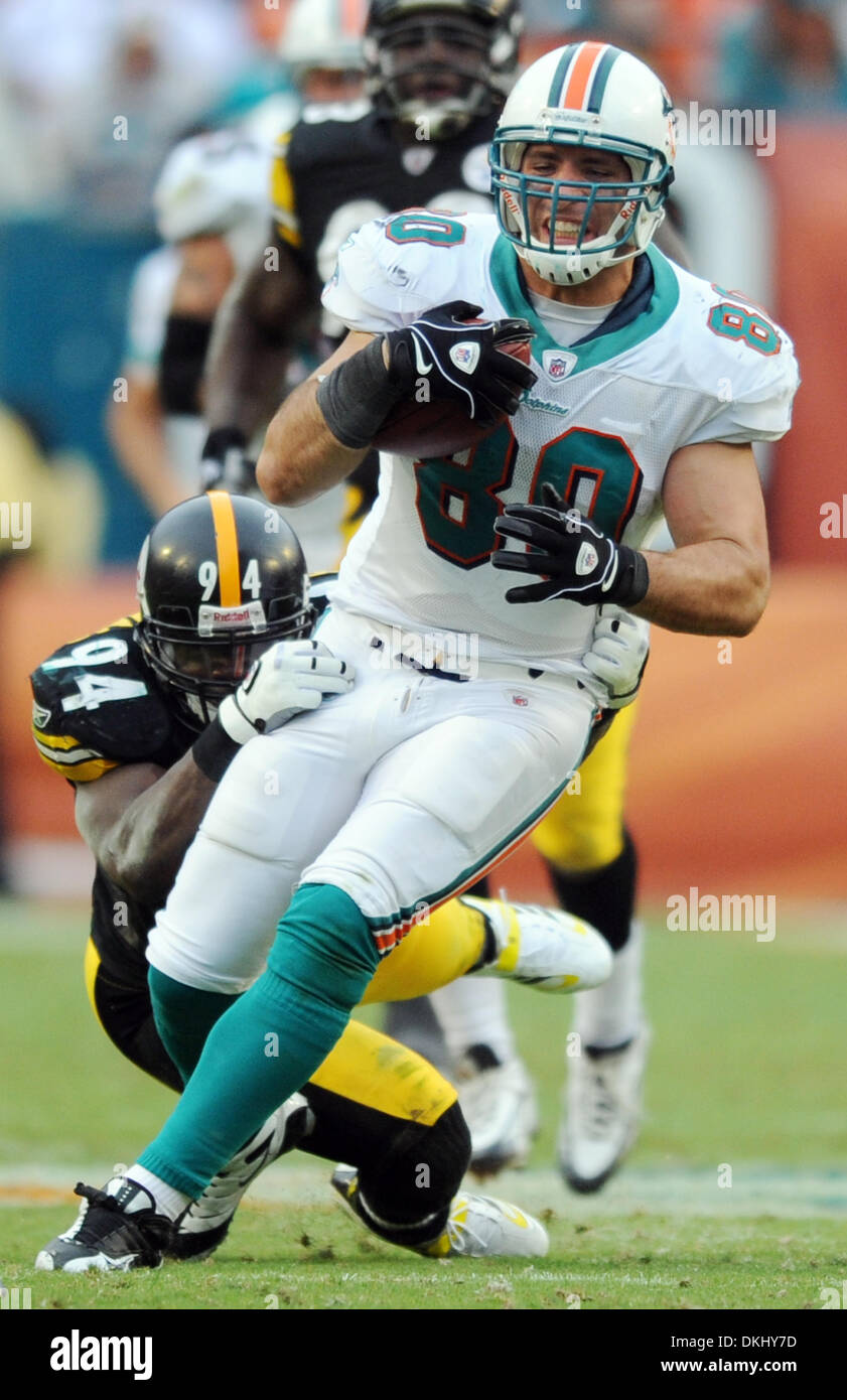 Jan. 03, 2010 - Ft. Lauderdale, Florida, USA - dolphinssteelersjr10310. Anthony Fasano of the Dolphins breaks free for a first down as Lawrence Timmons makes the tackle.  1/3/10. Jim Rassol, Sun Sentinel  (Credit Image: © Sun-Sentinel/ZUMApress.com) Stock Photo