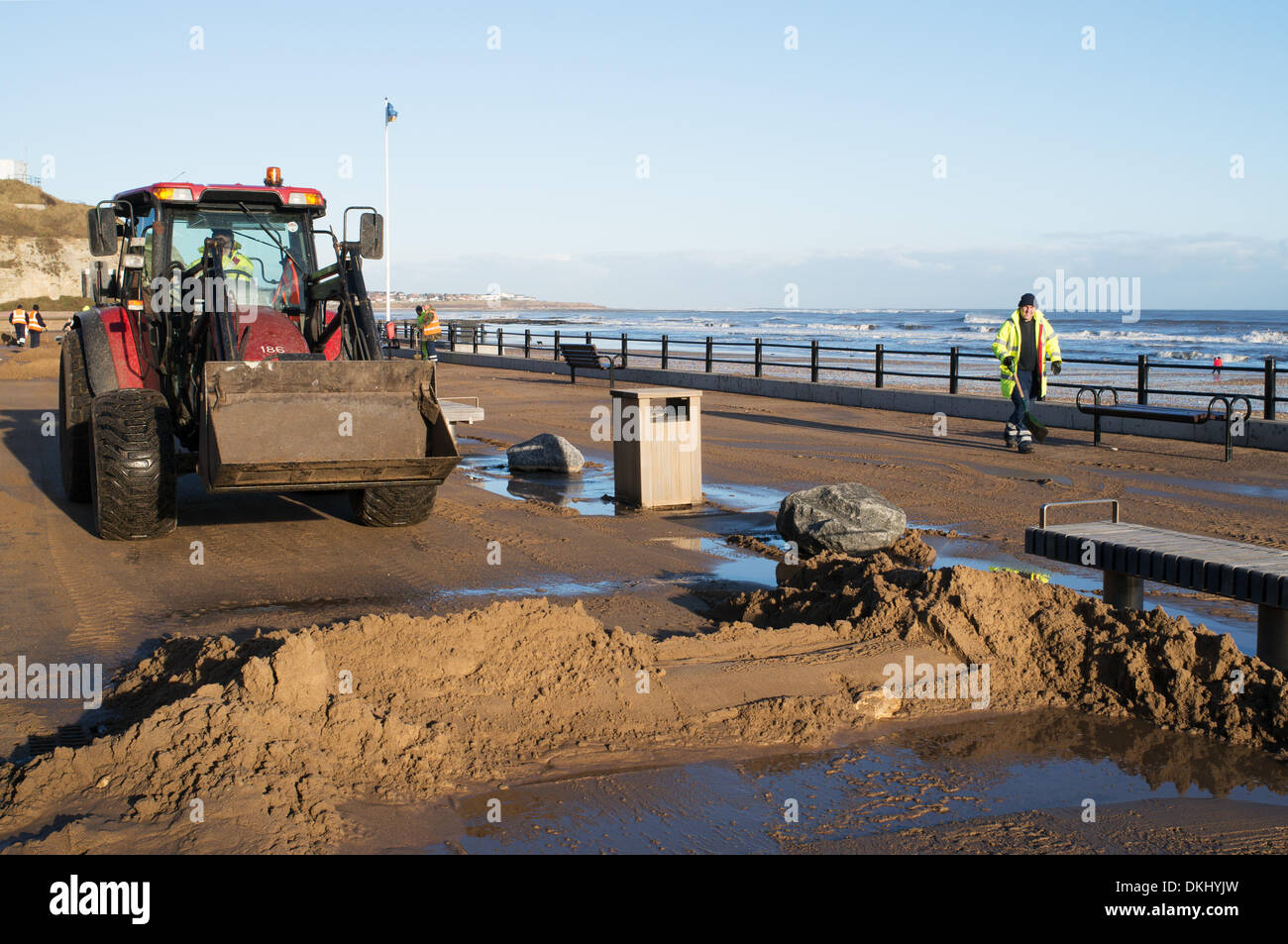 Roker Sunderland, Tyne and Wear, UK . 06th Dec, 2013. Following 60 year high tide last night workmen clearing sand and debris from the promenade at Roker in Sunderland, Tyne and Wear, England 6-12-13 Credit:  Washington Imaging/Alamy Live News Stock Photo