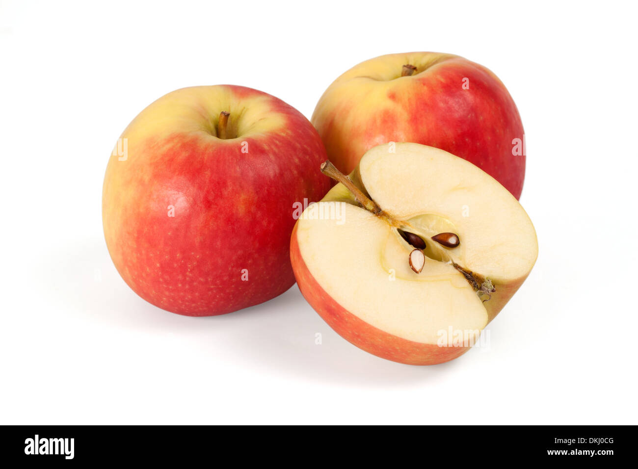 Two apples and half apple sliced on white background Stock Photo