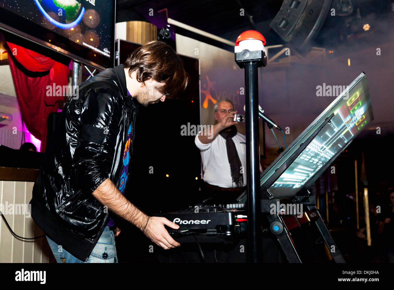 DJ Alvaro Reina next to the mixer to begin the party of the hot mix energy danceflor of the Los 40 Principales Stock Photo