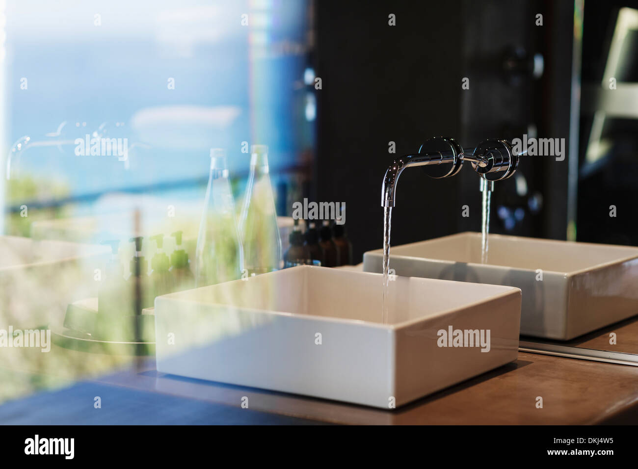 Sink and mirror in modern bathroom Stock Photo