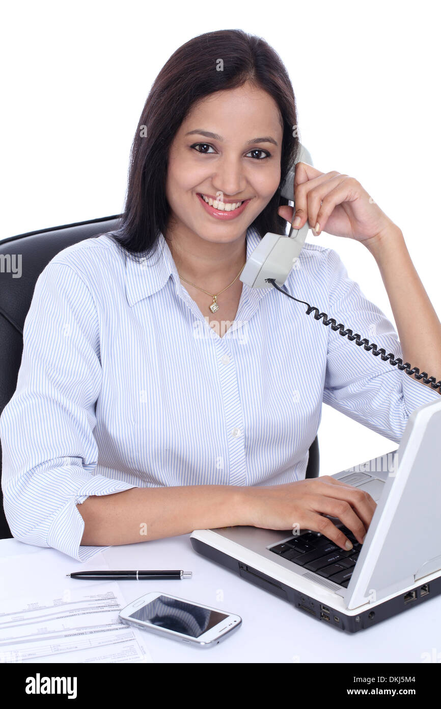 Cheerful young Indian business woman talking on phone Stock Photo - Alamy