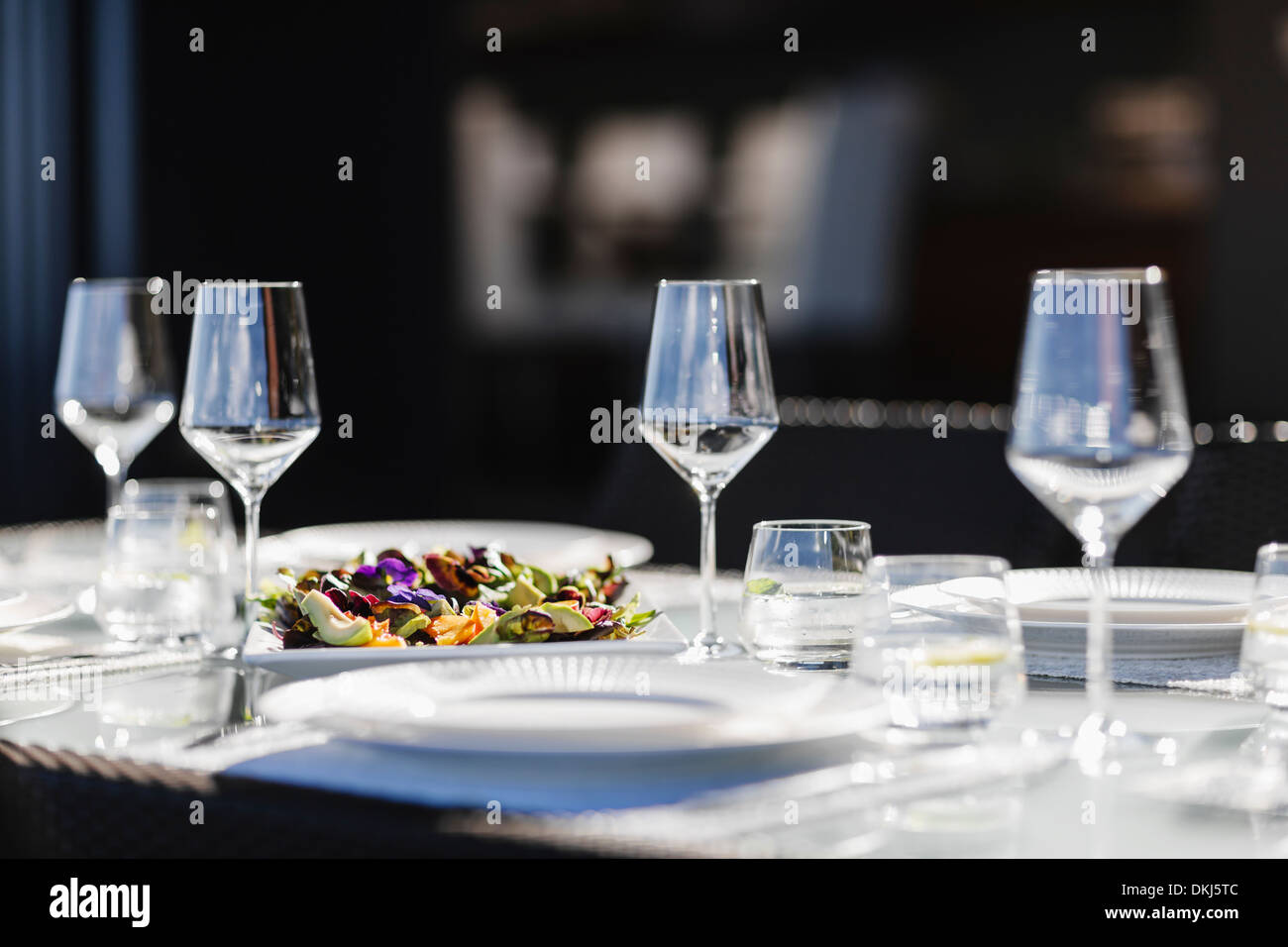 Place settings on elegant dining table Stock Photo