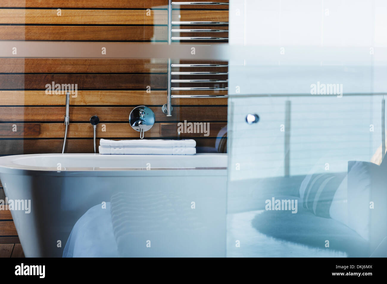 Bathtub and glass door in modern bathroom Stock Photo Alamy