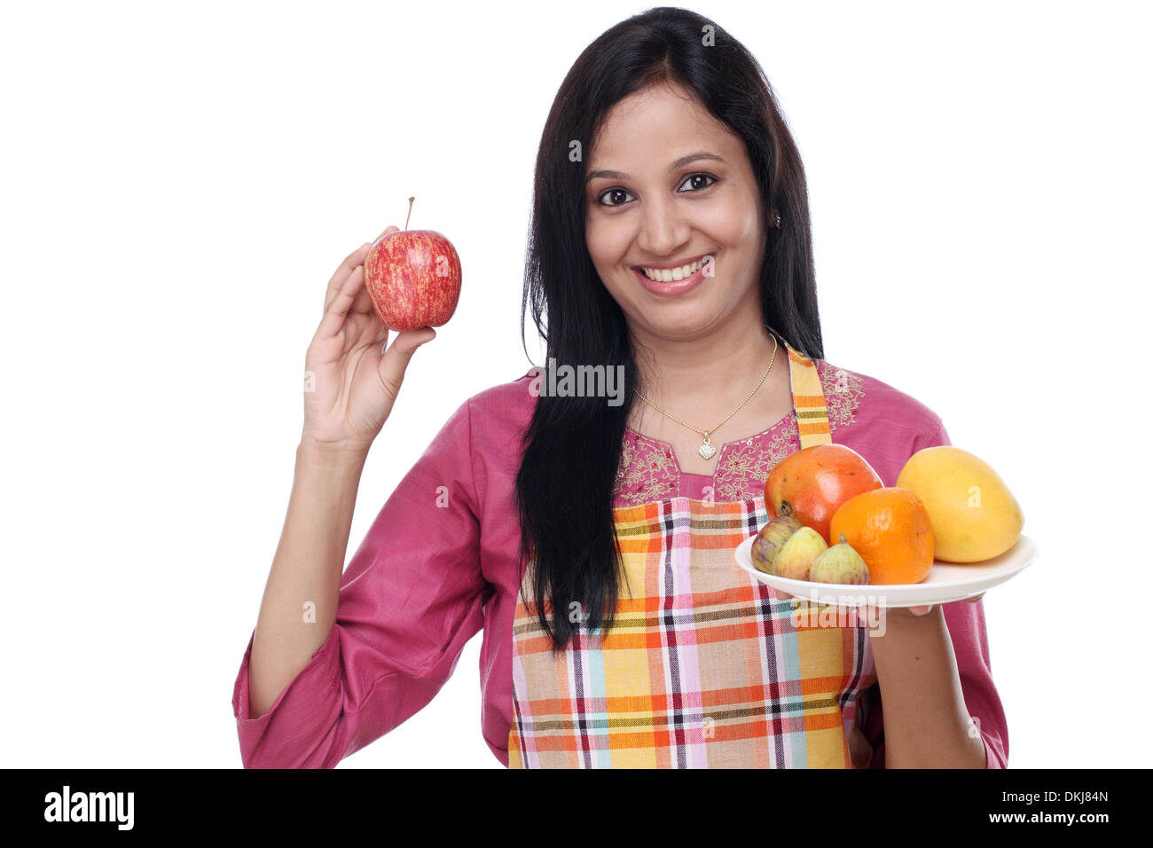 Young happy smiling woman with plate of fruits Stock Photo - Alamy
