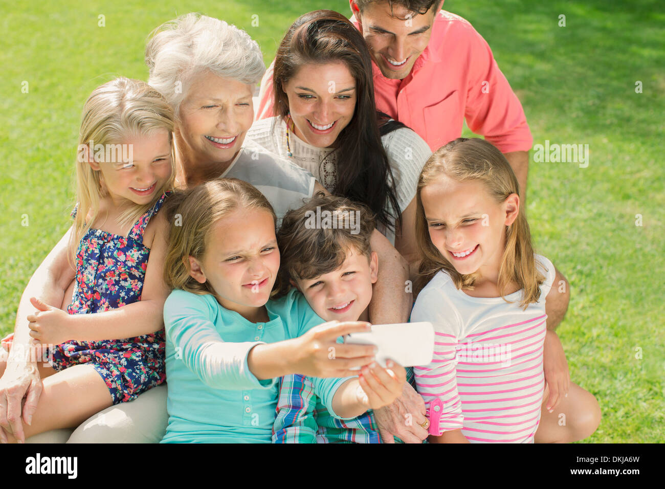 Family taking picture together with cell phone Stock Photo Alamy