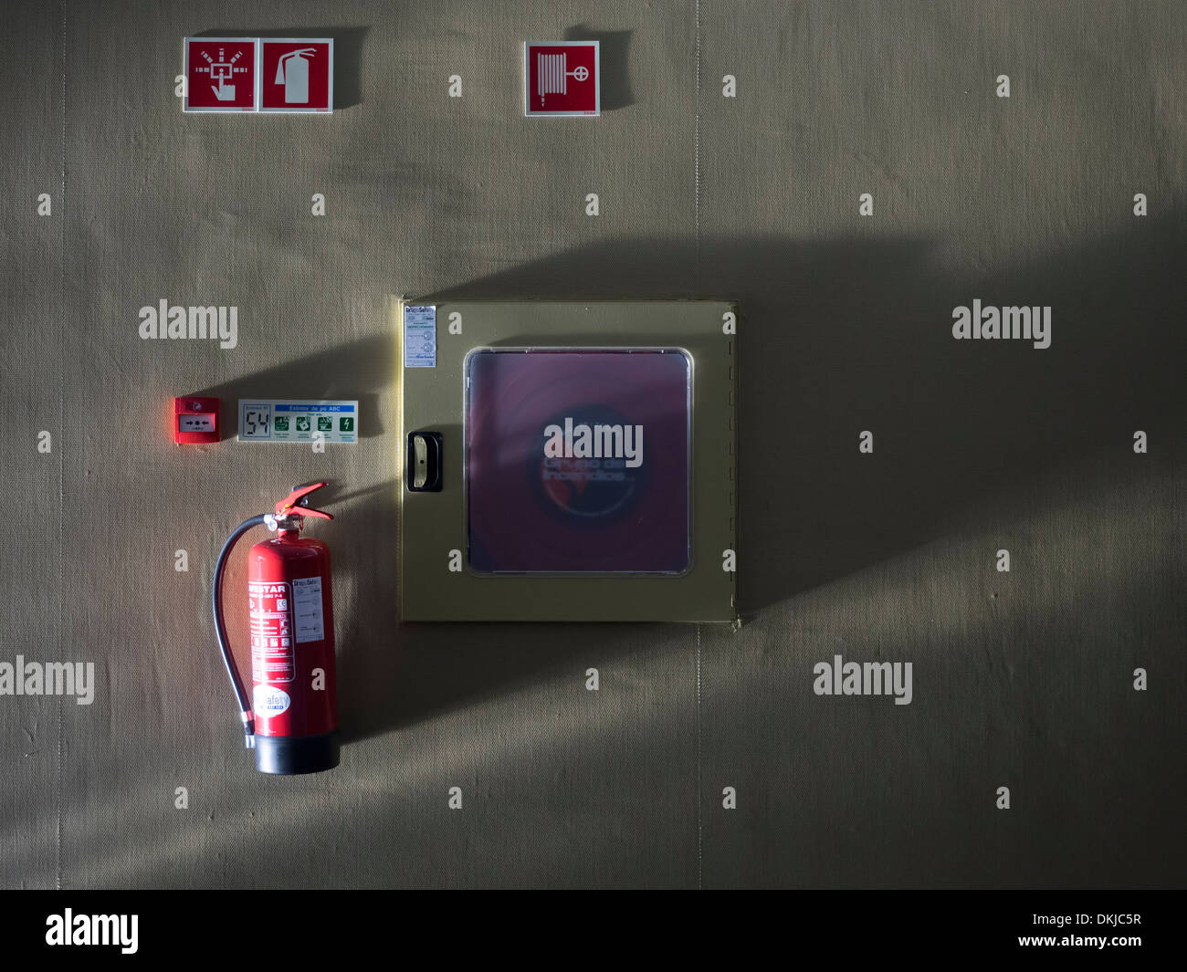 Fire extinguisher mounted on a wall Stock Photo Alamy