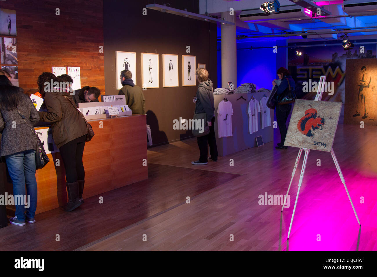 Manchester City UK. 6th December, 2013. Visitors to Street Art exhibition at Deansgate