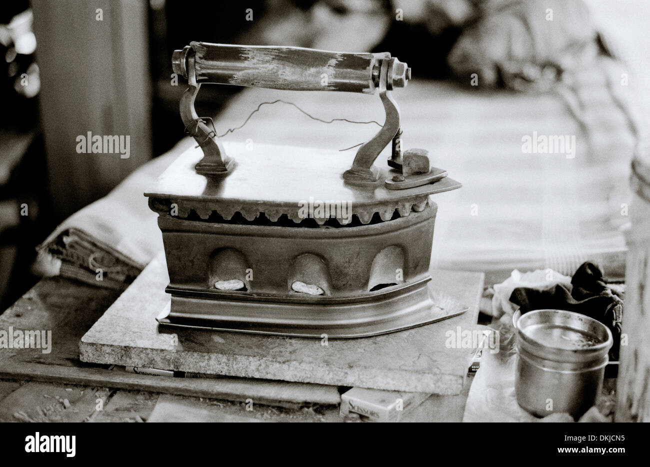 asia, asian, india, woman ironing cloth with an old fashioned metal iron  Stock Photo - Alamy