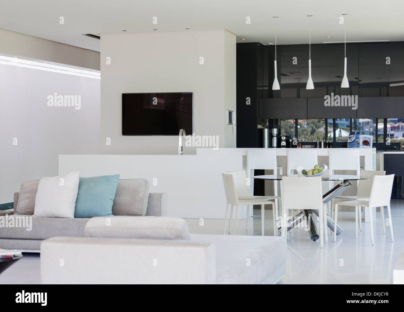 Sofa and dining table in modern living space Stock Photo - Alamy