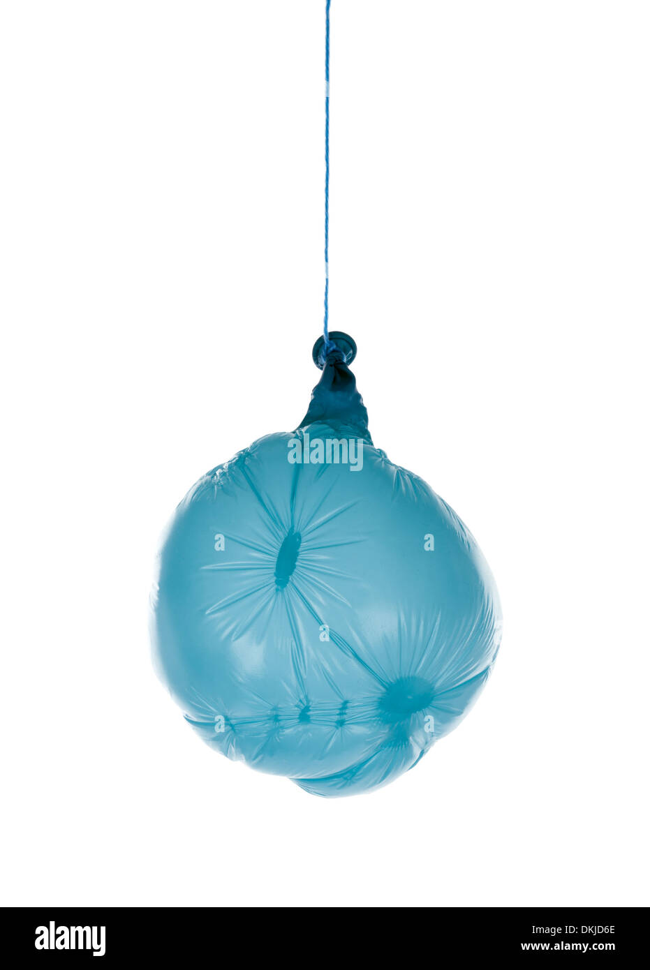 Deflated blue balloon at a rope; isolated over white Stock Photo
