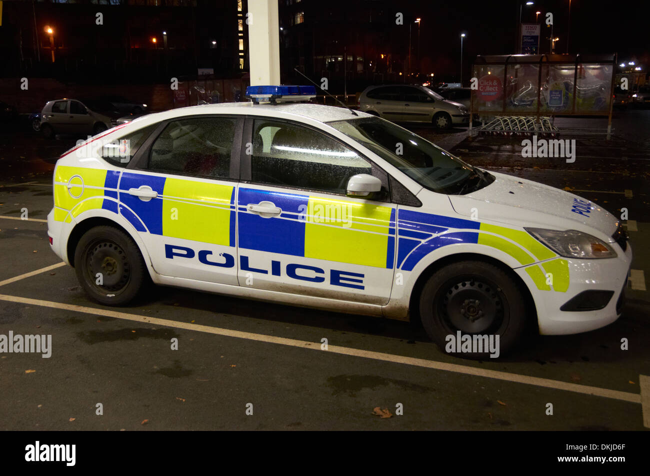Police car in a supermarket car park. Stock Photo