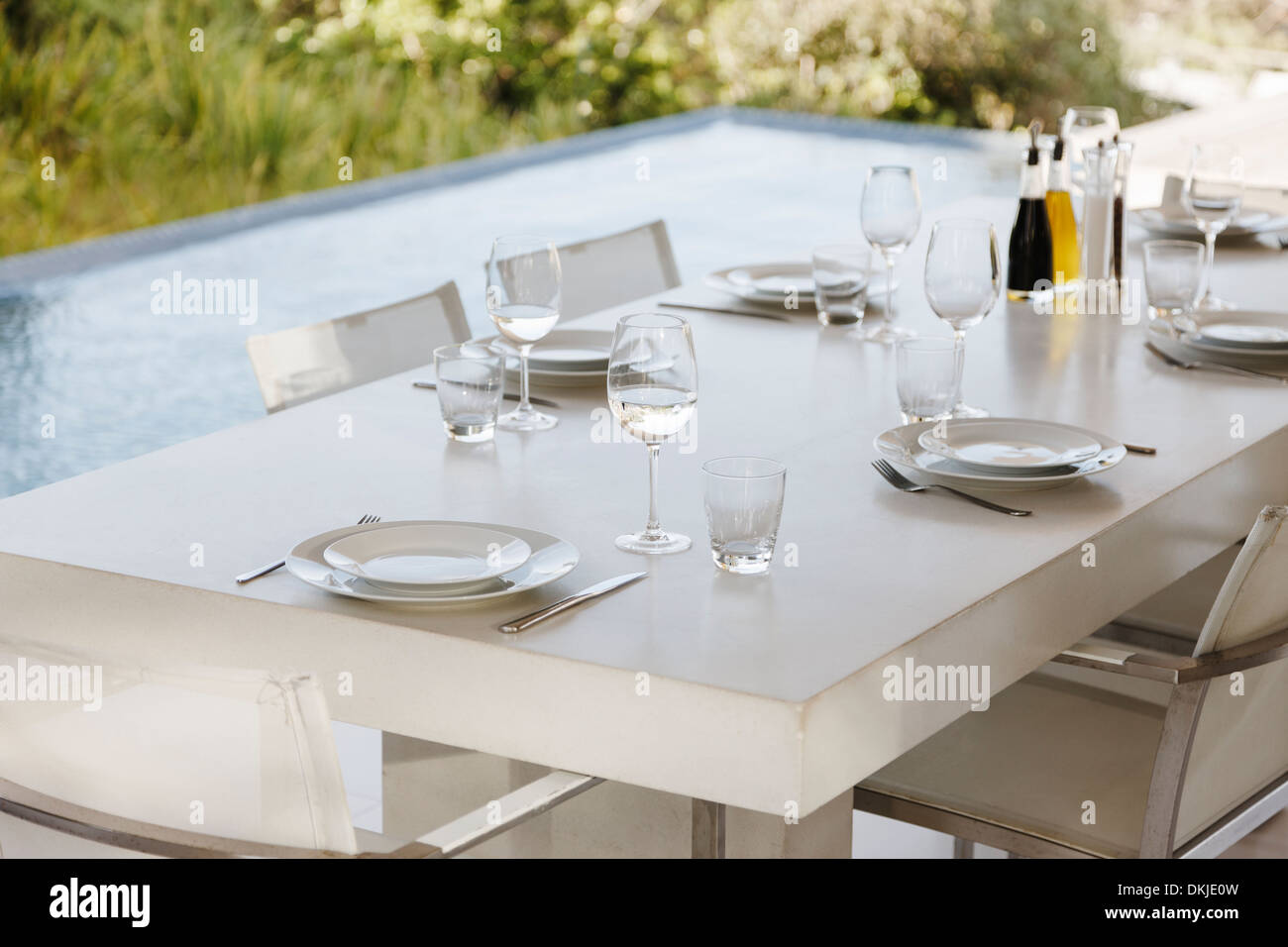 Set table on modern patio Stock Photo